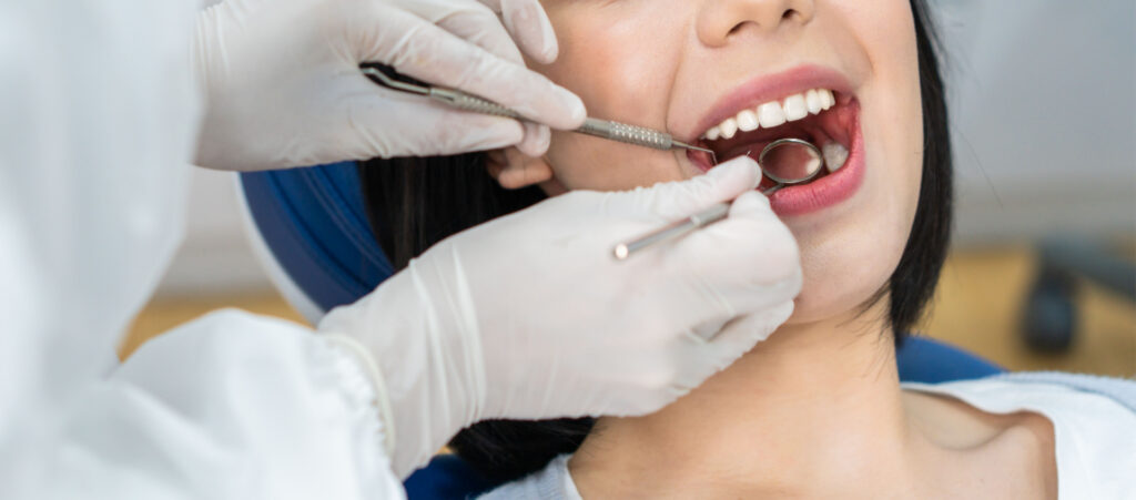 A woman receiving a Dental Cleaning